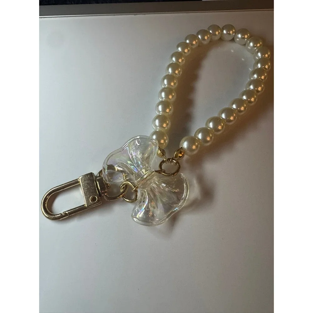 Faux Pearl Wristlet Keychain with Iridescent Bow Charm Gold‎ Tone Hardware Cream